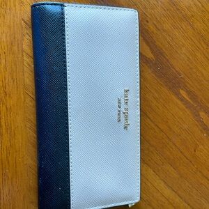 Ladies Kate spade leather wallet like new beige and brown has plenty of room.